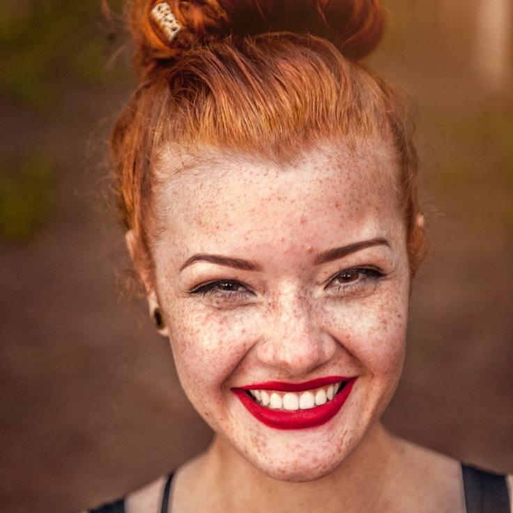 Kaveri Mehta, Lead Design Curator at SpringHarborNode, reviewing corporate floral arrangements